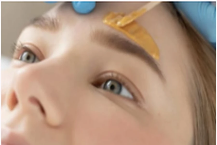Close-up of eyebrow grooming treatment